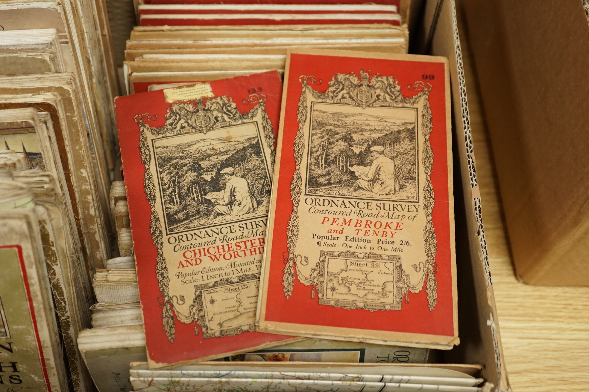 Twenty, one inch Ordnance Survey maps, together with thirty Ordnance Survey Tourist Maps, etc, 1920s/30s (50). Condition - poor to fair.